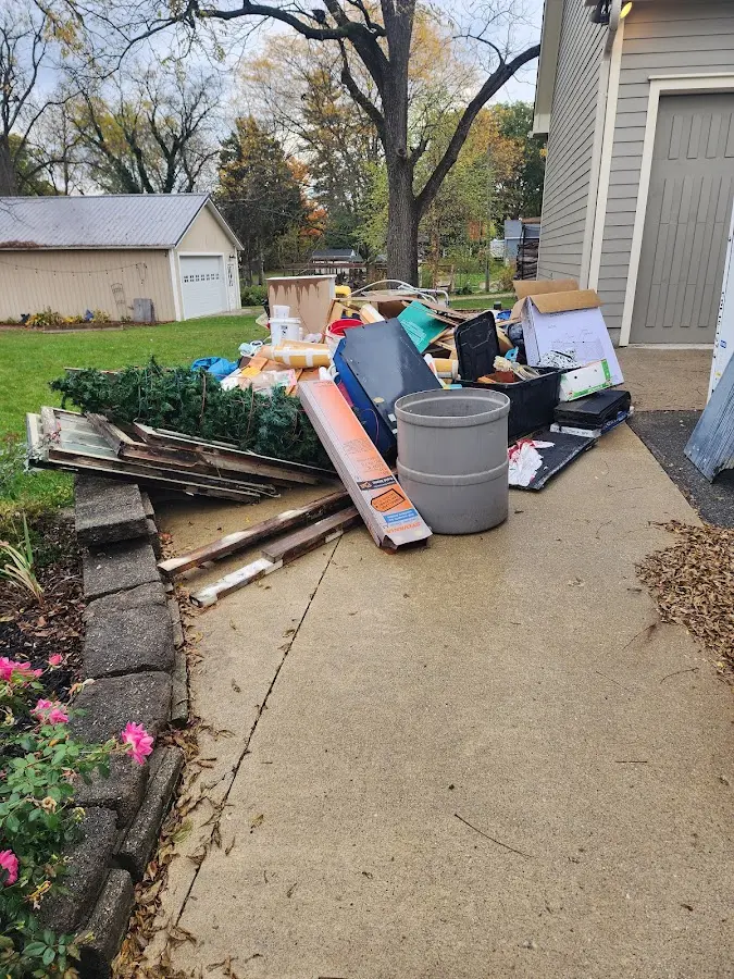 Dumpster being loaded with debris for 30 Yard Dumpster Rental in Marlboro Meadows